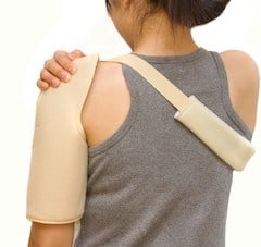 Girl with dislocated shoulder in sling wondering if she needs surgery